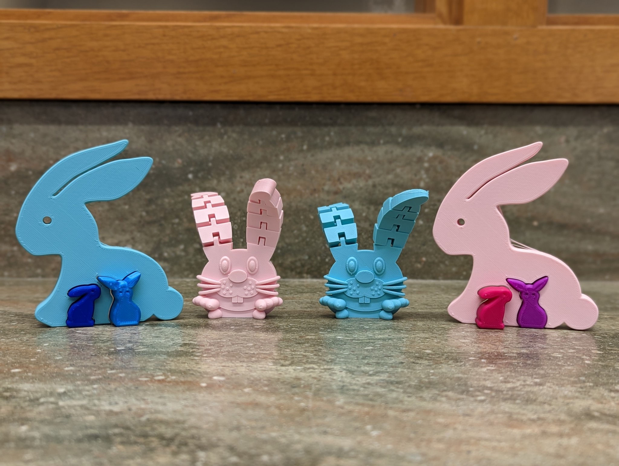 2 blue and 2 pink easter bunny puzzles and toys printed as gifts for a patron!