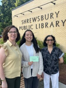 Photograph of 3 women standing in front of the Shrewsbury Public Library